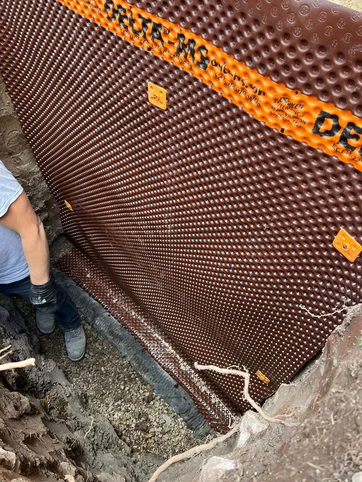Licensed professional waterproofing crew excavating Toronto home foundation
